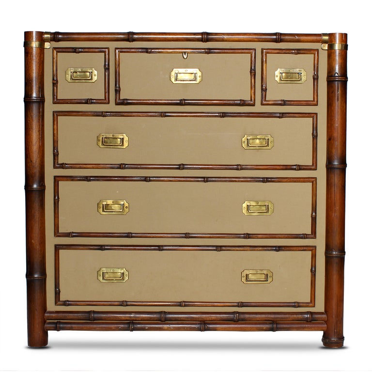 A very stylish campaign style chest, with upholstered flat surfaces, bamboo show wood and campaign pulls. Labelled Polo, Ralph Lauren.

All pieces at FS Henemader are professionally examined, and any issues are professionally addressed returning