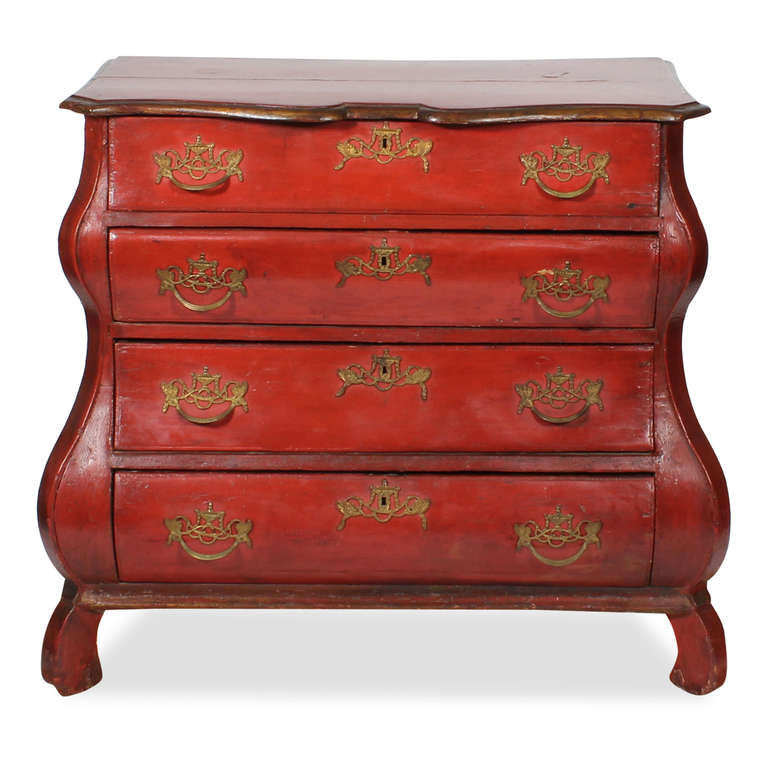 A beautiful 18th century Dutch bombe chest or commode with wonderful proportions, beautiful lines and a great painted surface. The color is a muted red, although a later paint, the artisan who painted this piece, was highly skilled, the depth and