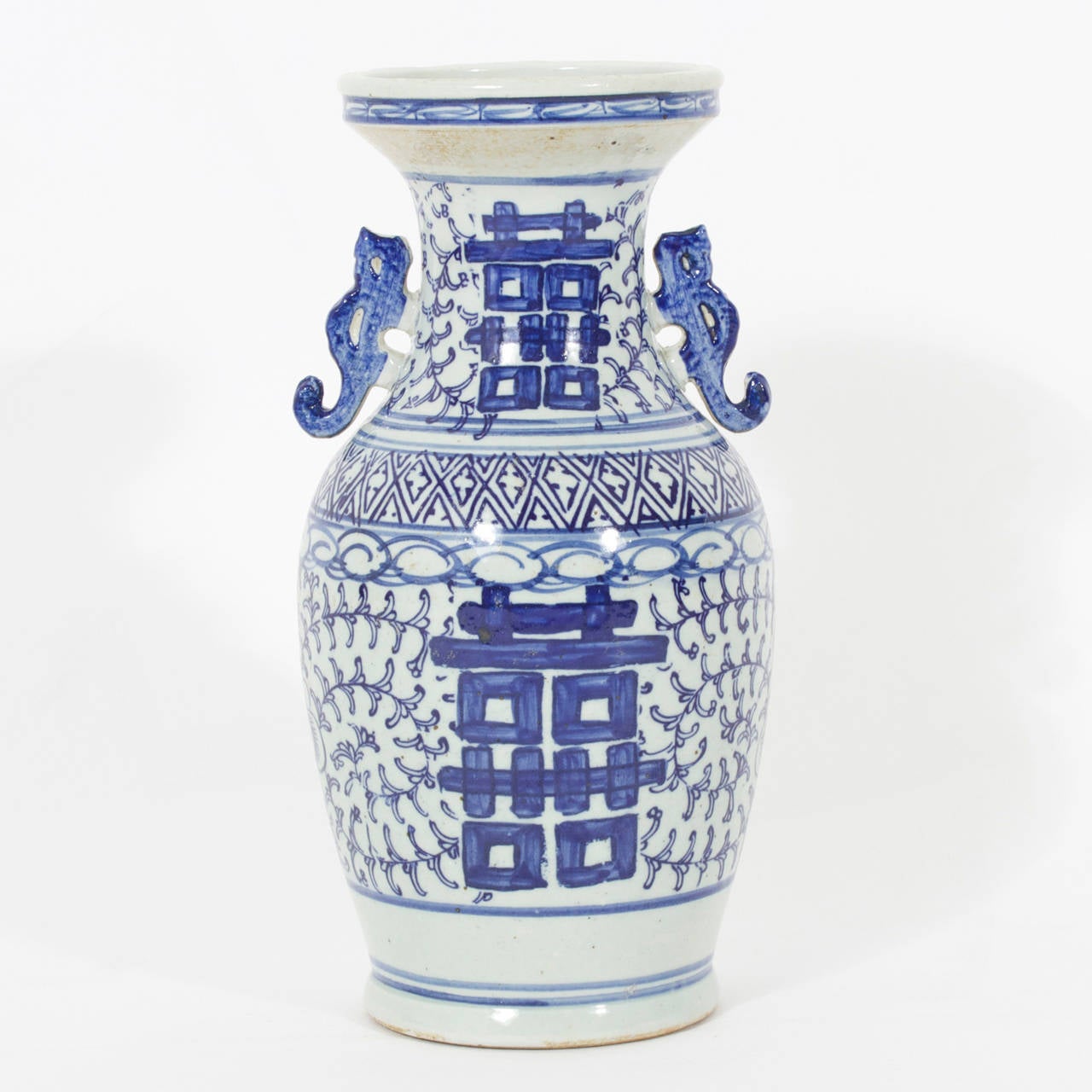 A pair of Chinese Export style blue and white porcelain vases, with a double happy motif, bold blue with a very nice design.

