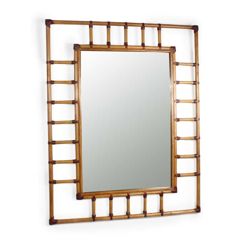 A very large rectangular rattan mirror with leather binding. Possibly McGuire. Great impact on the wall.

fshenemaderantiques for more