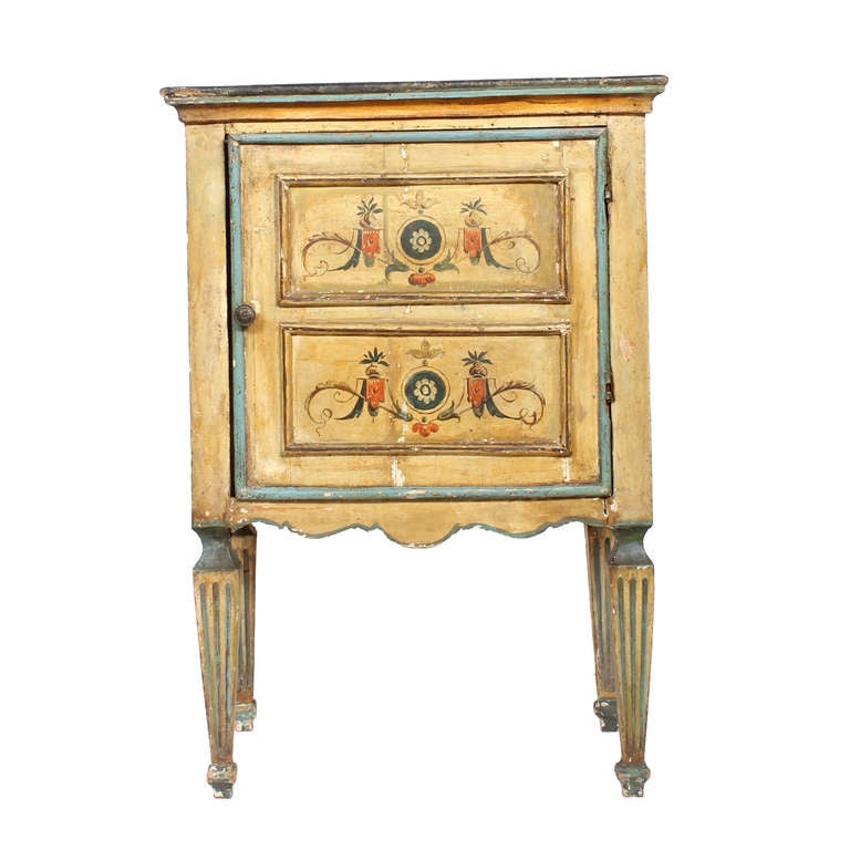 A Late 18th C. or Early 19th C. Italian table with 2 faux drawers opening as a door, on tapered fluted legs. Beautiful painted surface. Typically Italian, with rustic qualities.
