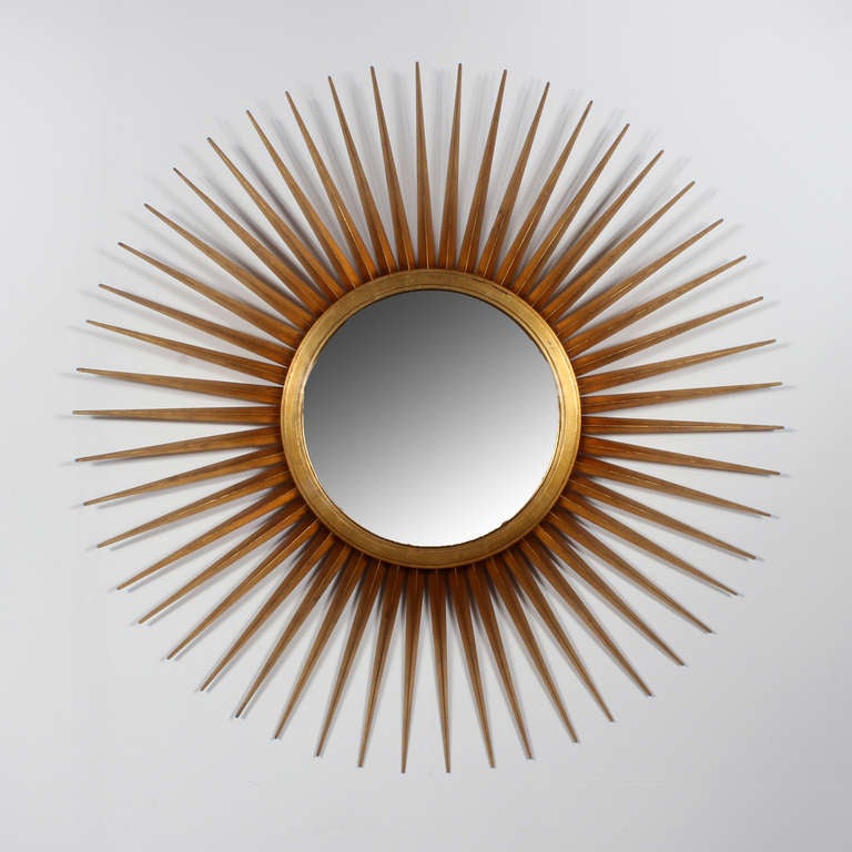 A very large giltwood multi rayed sunburst mirror, excellent quality and design. Convex mirror. Labelled Baker.
.