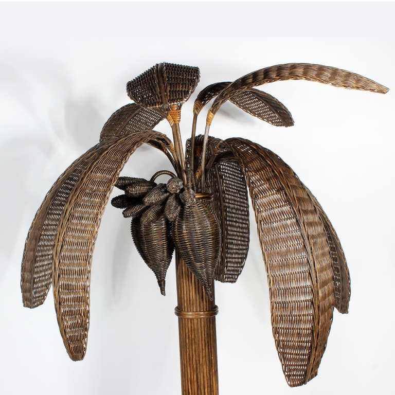 A really wonderful rattan and woven wicker palm tree floor lamp, with well crafted and detailed leaves, coconuts and seed pods.
Newly wired. Switched on the trunk.

Every piece in our inventory is evaluated for condition and functionality, and