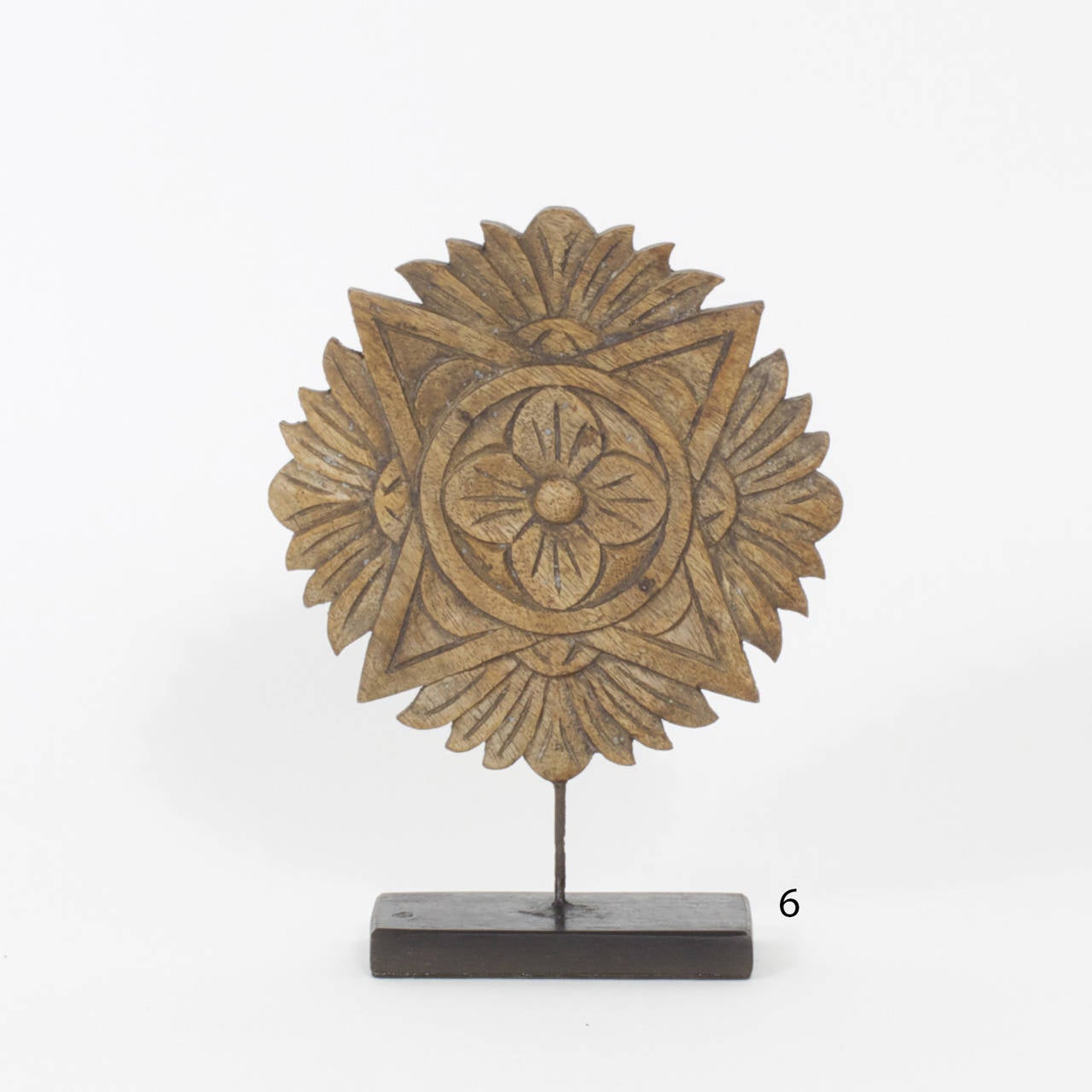 Intriguing group of four architectural fragments in an assortment of sizes, shapes and tones. Each fragment is individually mounted on a wooden base to showcase the nature of the carving and the depth of the patina. These Indian carvings work well