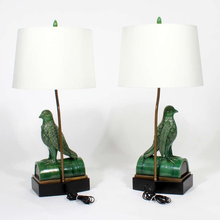 A pair of custom made, large and impressive green majolica roof tile lamps in parrot form. Very robust and expensively made custom pieces, from the estate of Casey Ribicoff.  One of the lamps is visible in a photograph of her in 1964, in her NY