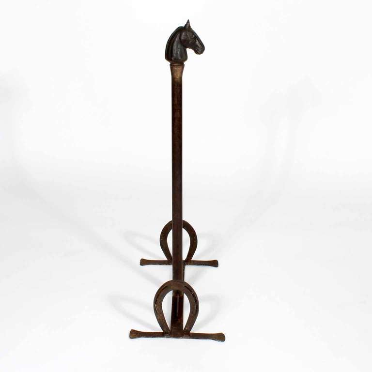 A 19th C. cast and forged iron stand up boot scraper with a cast iron horse's head, and horse shoes, joined with forged iron bars and feet. A truly amazing piece. Perfect for the gentleman farmer.