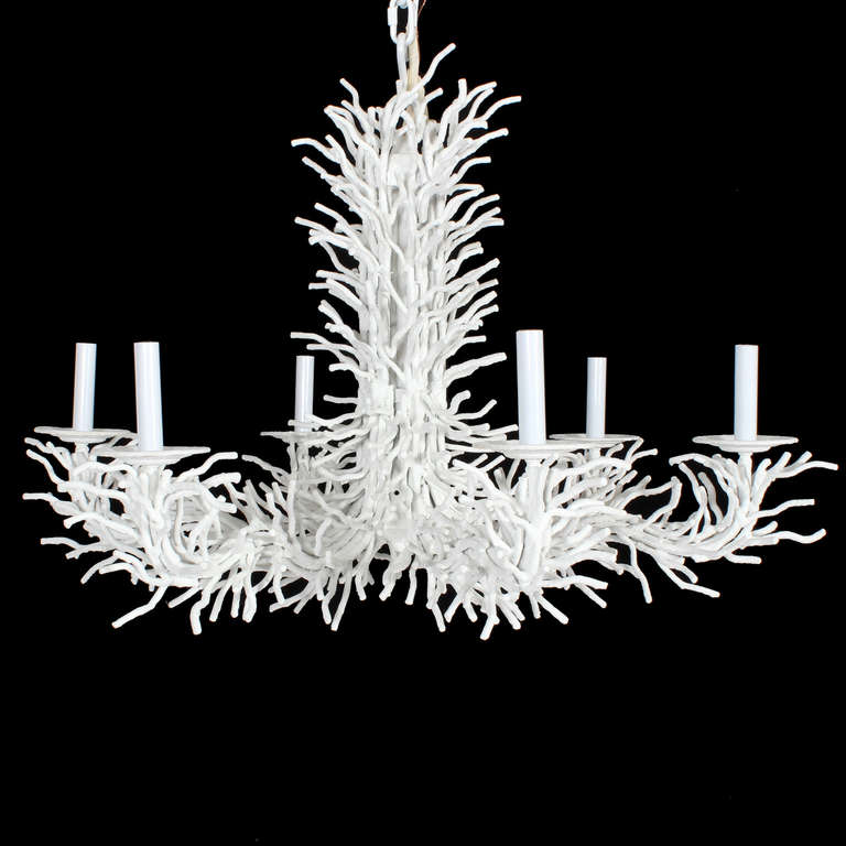 An excellent example of a large textured white painted six arm faux coral chandelier in iron,  with a great form, and lots of faux coral branches, which give the chandelier a full and accomplished look. Newly wired, with a white canopy and chain.