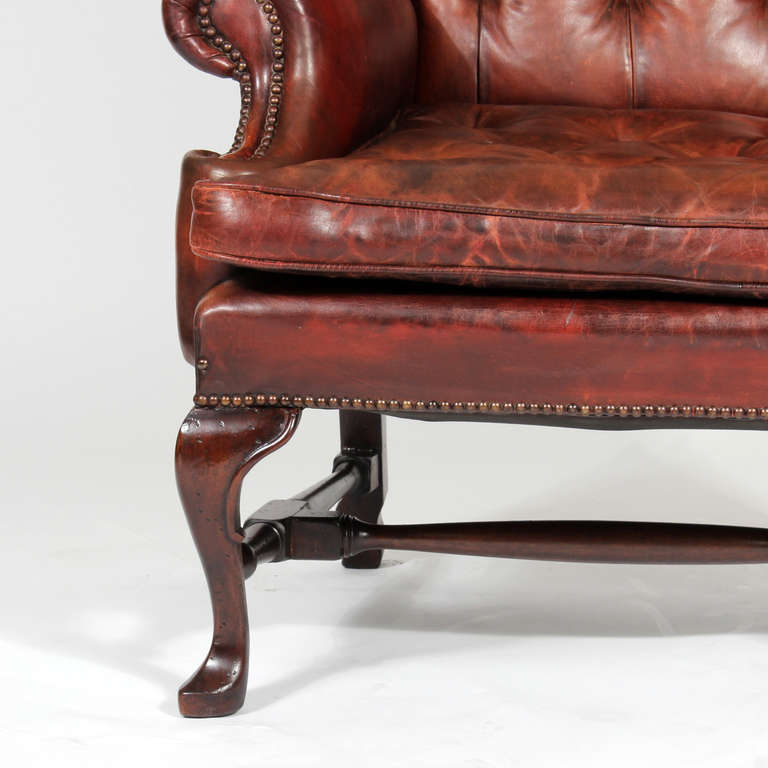 English Pair of Early 20th Century Brass Tacked Tufted Leather High Back Wing Chairs