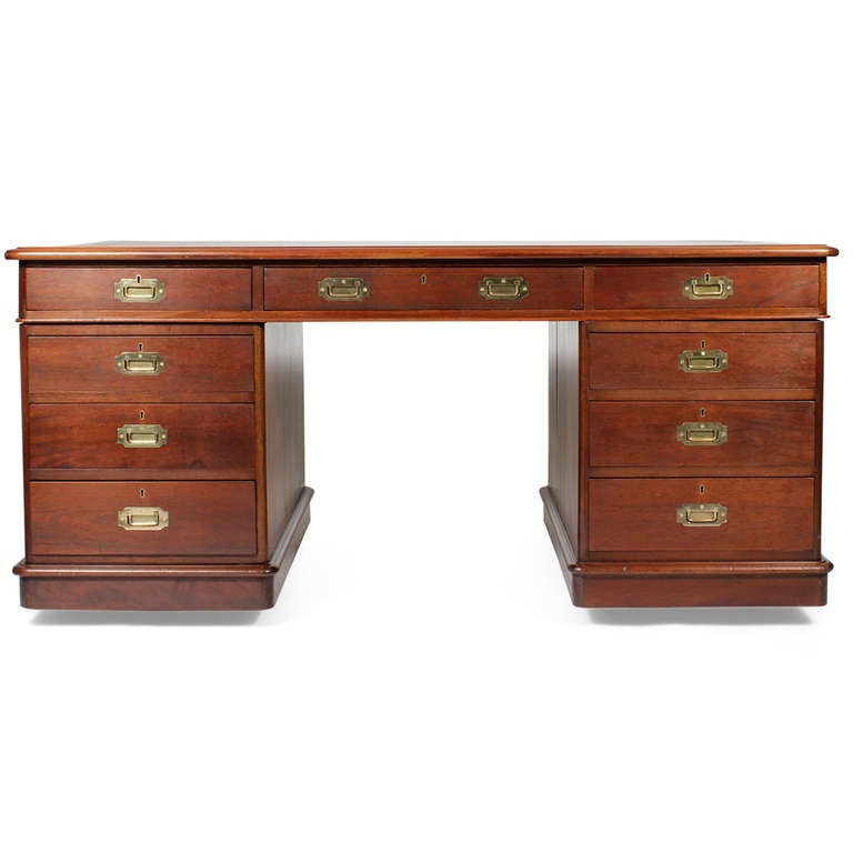 A large mahogany campaign partners desk, with workable drawers on both sides of the desk, a a beautiful tooled leather top and a well crafted dovetailed case and drawers. Hard to find, and beautiful to look at!

Every piece in our inventory is