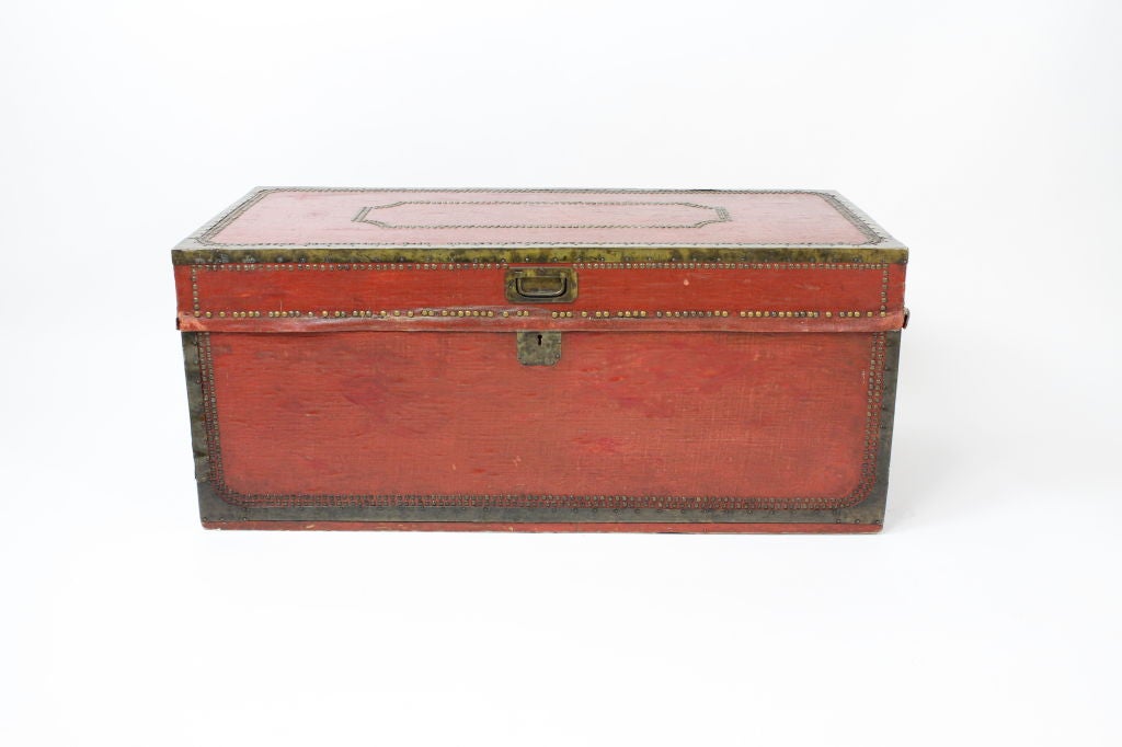 A Chinese export canvas covered camphor wood box, with brass tack decoration, in rare red.<br />
<br />
Please visit our website at www.fshenemaderantiques.com .