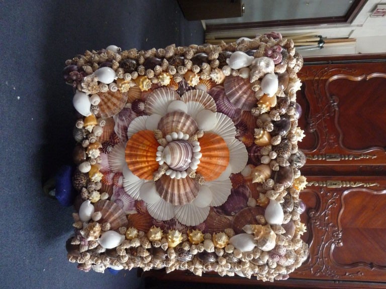 A very large and impressive sea shell planter, with great colors and design. Custom sizes available.<br />
<br />
Please visit our website at www.fshenemaderantiques.com .