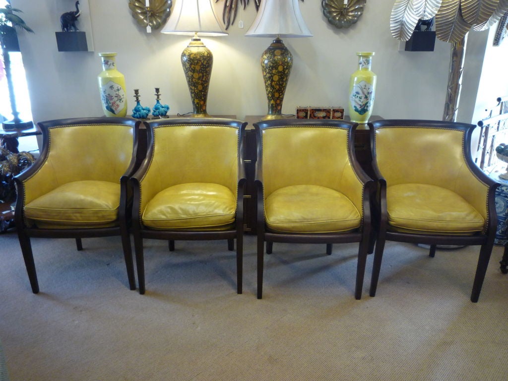 A set of four mahogany chairs, in the Regency manner, with the original leather upholstery. The upholstery has been removed tightened and retacked, for a comfortable sitting experience. 

 