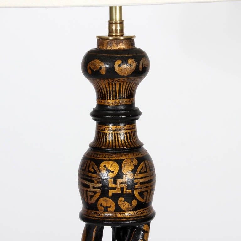 A made for the English market, Chinese export carved to a barley twist floor lamp, once probably a torchiere. Lacquered in black and burnished with gold Asian motifs. Classic, chic and full of soul, perfect for that dark space in any interior. Newly