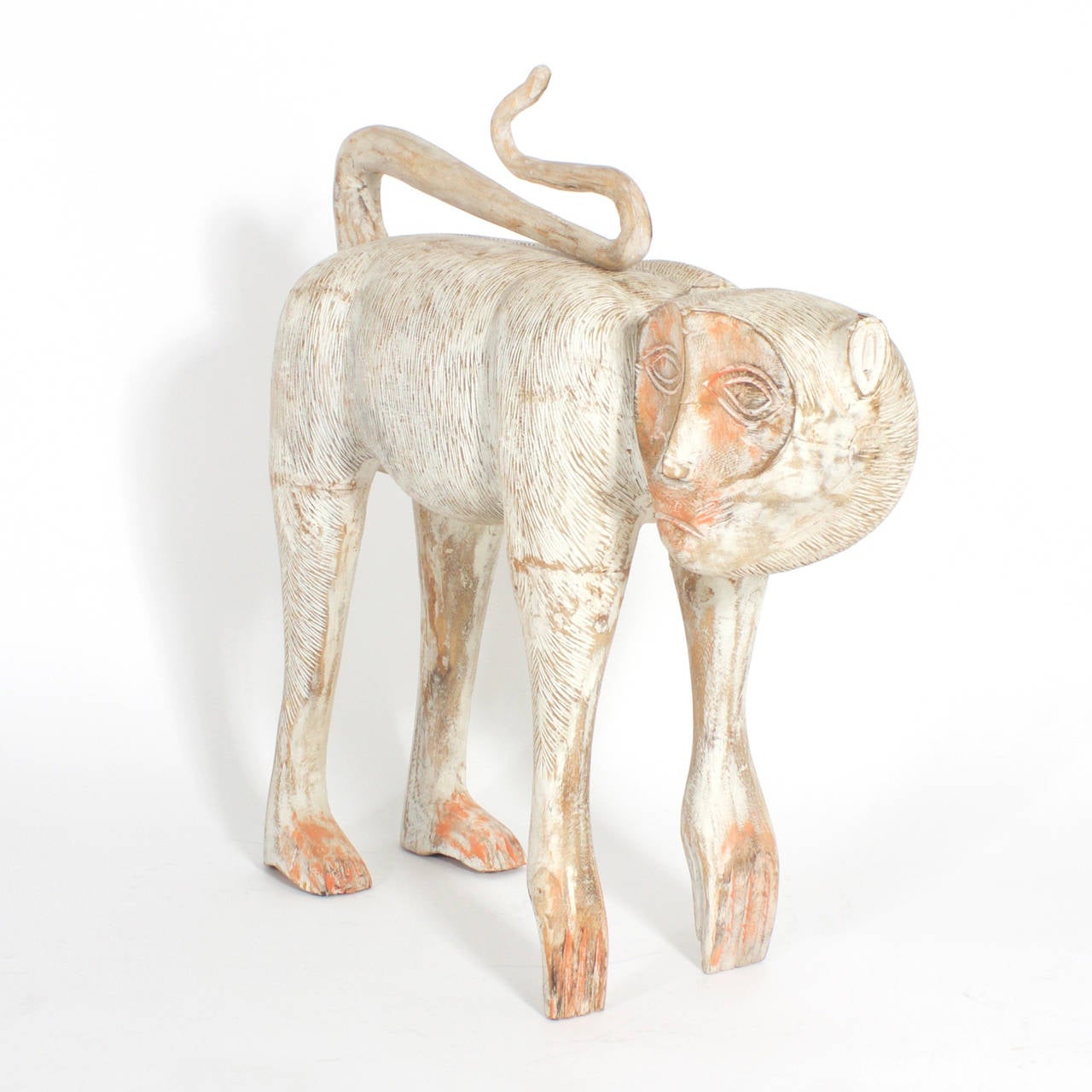 Mid-Century carved wooden monkey with attitude finished with a distressed, and time worn look. Featuring a curious, removable tail and an overall Primitive tribal vibe.
