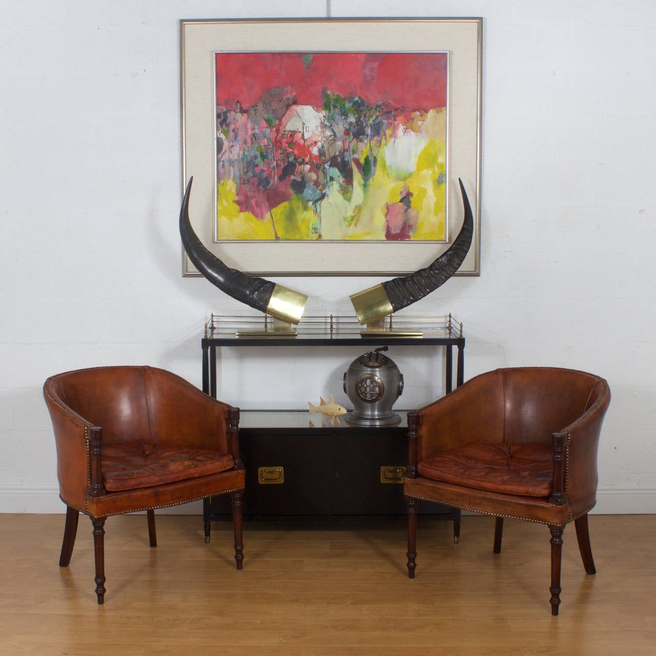 Big and bold pair of Mid-Century faux water buffalo horns presented on sleek polished brass bases. Can be used as bookends or just enjoyed as decorative objects of art. Newly polished.