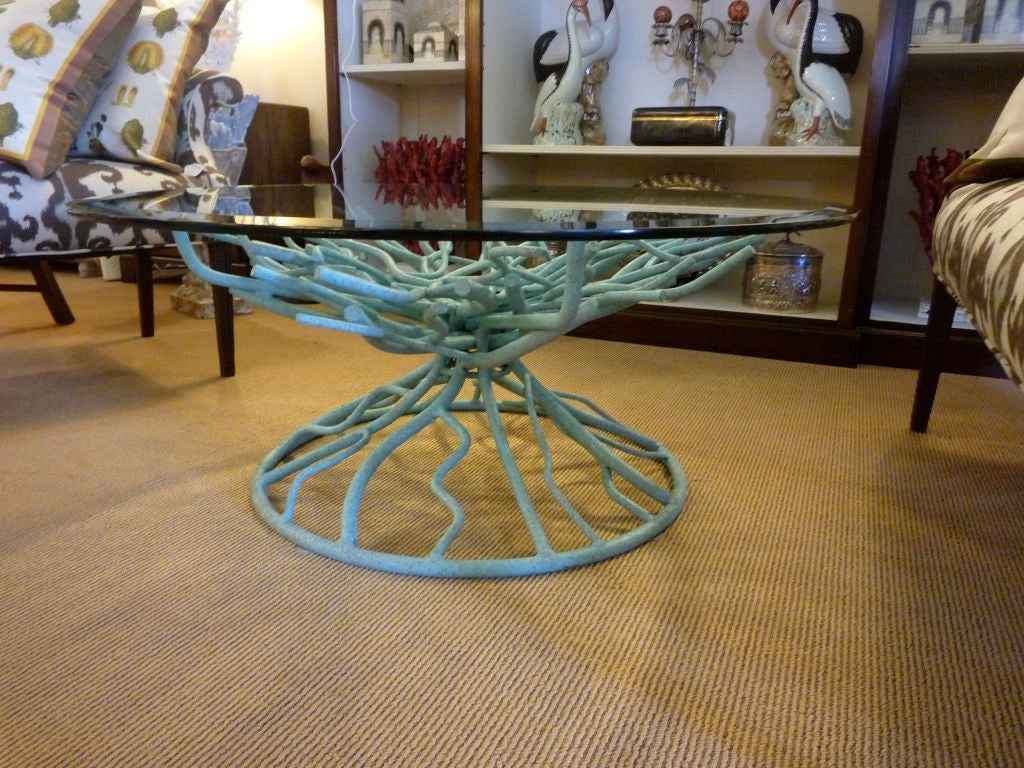 A Glass Top and Patinated Iron Blue Coral Cocktail Table