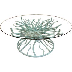A Glass Top and Patinated Iron Blue Coral Cocktail Table