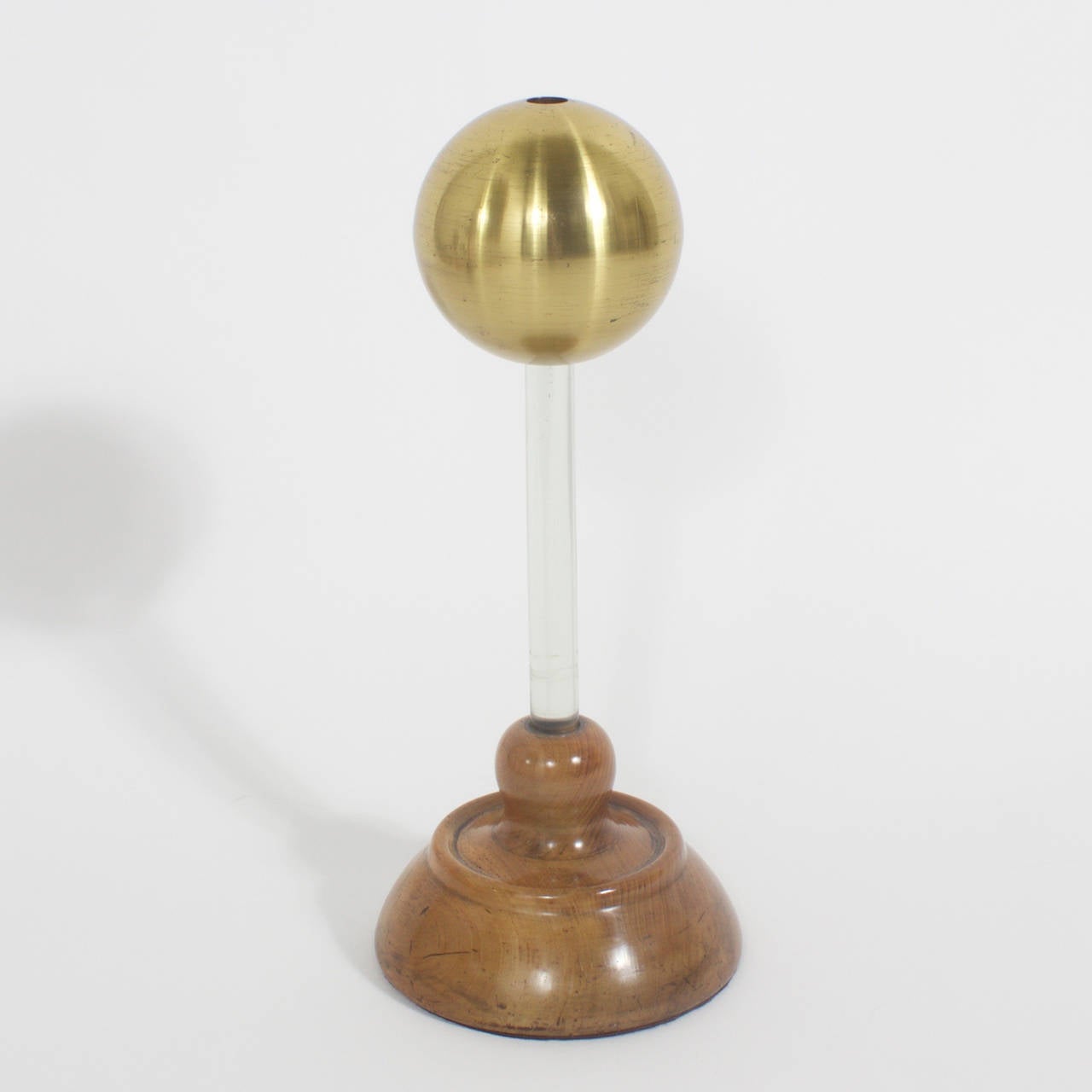 As if right out of a Jules Verne novel here is an assortment of four electrostatic conduction instruments that have a very sculptural vibe, with steampunk tones. Having upper spheres of brass, copper and chrome mounted on various colored Lucite
