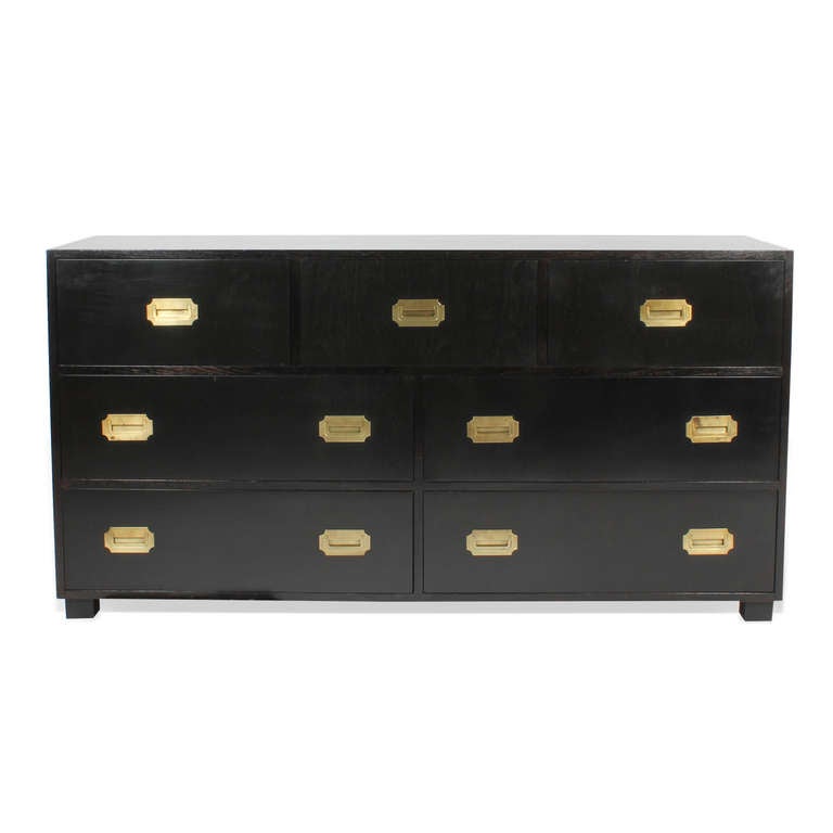 A Baker dresser or chest, in ebonized mahogany, a block foot, and recessed brass hardware. Excellent quality with elegant simple lines and a great finish.