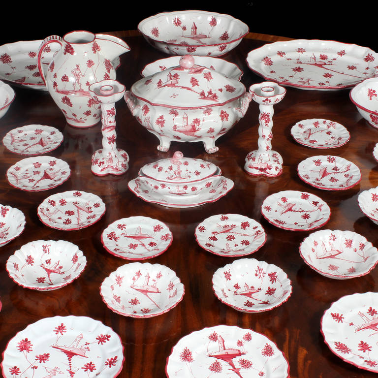 Enjoy sophisticated casual dining with this set of Italian faience, which includes hard to find serving pieces and candle sticks. Red on white painted folk scenes and scalloped edges. Why go all the way to Tuscany?
Set includes Eight- 9
