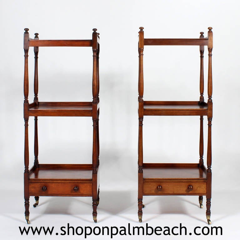 A fine and useful pair of 19th century English, mahogany set of shelves or etageres, with finely turned legs, three shelves and drawers. Long ago sold at one of Chicago’s finest retailers and still retaining a metal label.
This elegant pair has