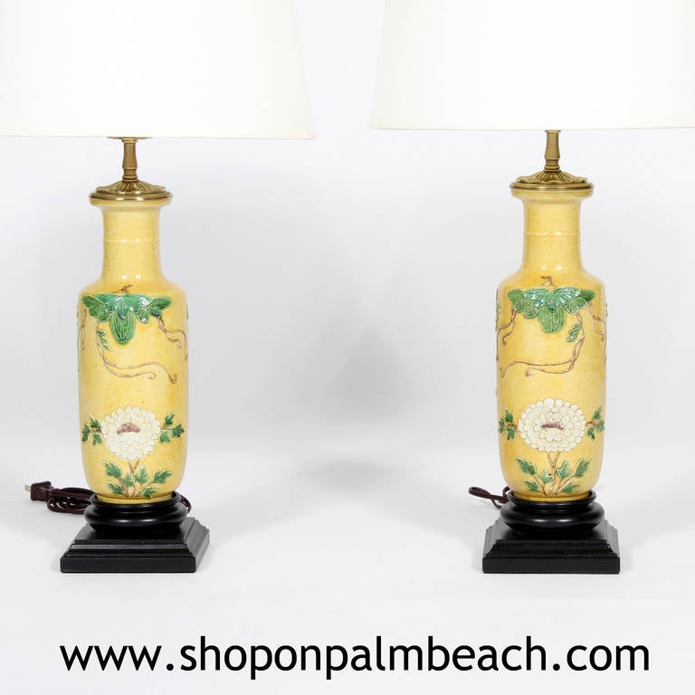 A pair of very striking Chinese Export Bing Rong vases converted to lamps, with lotus flower and foliage decoration, mounted on ebonized bases. Beautiful form and colors. Newly wired. Base 5