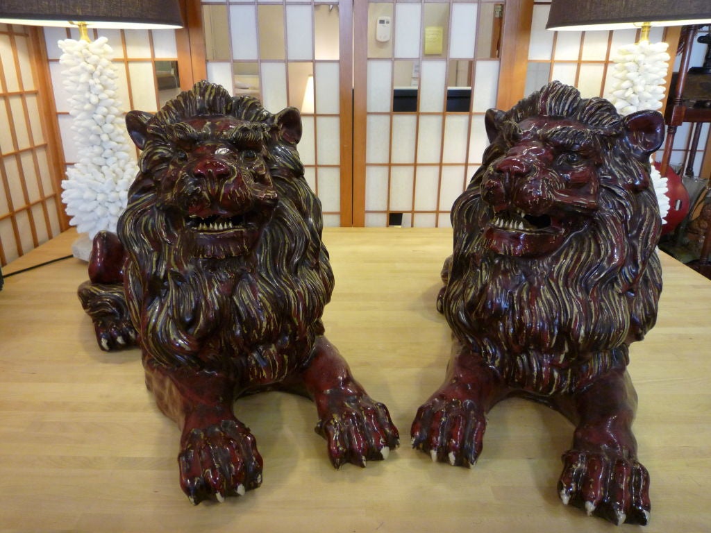 British Colonial Pair of Early 20th Century Glazed Stoneware Hand Formed Lions