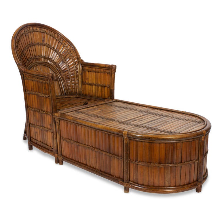 Warm and inviting rattan chaise lounge reportedly from the family of Charlie Chaplin. Tight construction with wicker rapping and a design that includes trundle storage compartment below. This piece is great place to nap or just relax. Newly cleaned