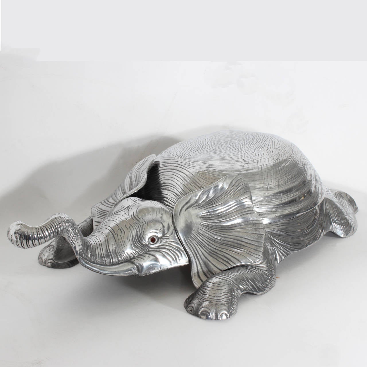 An amusing Arthur Court cast aluminum elephant, signed and dated 1979 with removable top, perfect for adding some humor to your dining table, crisp casting and realistic wisdom in its eyes. Very nicely polished.
