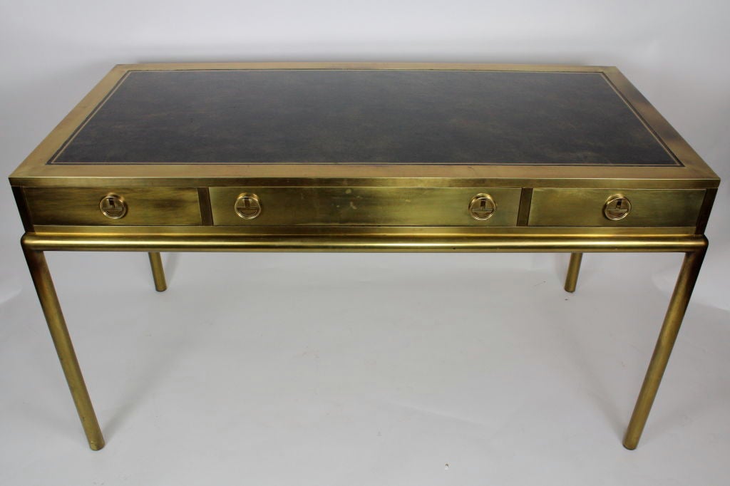 A 3 drawer leather top Mastercraft desk in great condition. The brass on this desk has a beautiful aged surface.<br />
<br />
Please check out our website at fshenemaderantiques.com