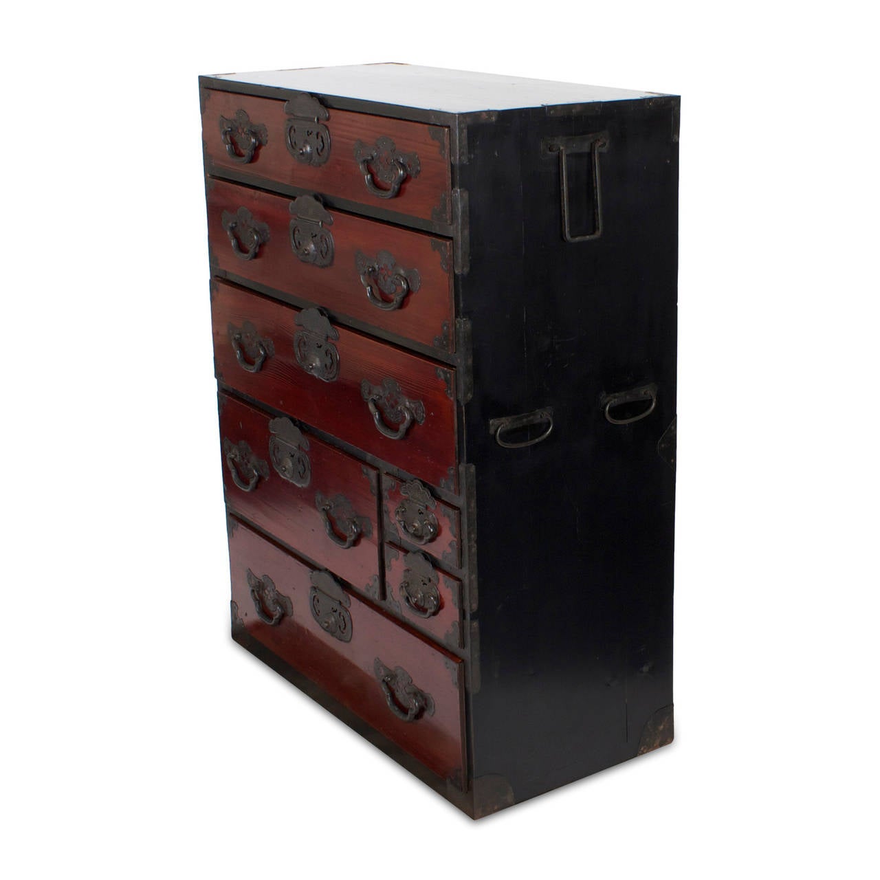 An antique painted softwood tansu chest of drawers with original black and deep red paint, intricate forged iron hardware and carrying with it all the mystery and intrigue of the Far East. Executed in the proportions of a gentleman's chest. Newly