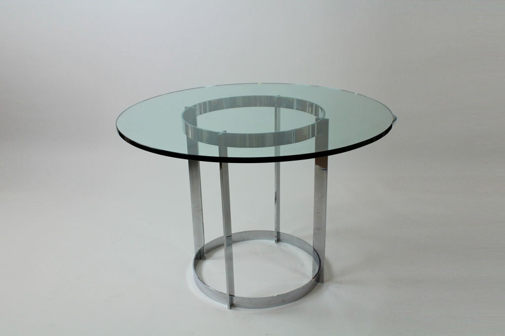 A circular glass stainless steel flat bar table.<br />
<br />
Please check out our website at fshenemaderantiques.com