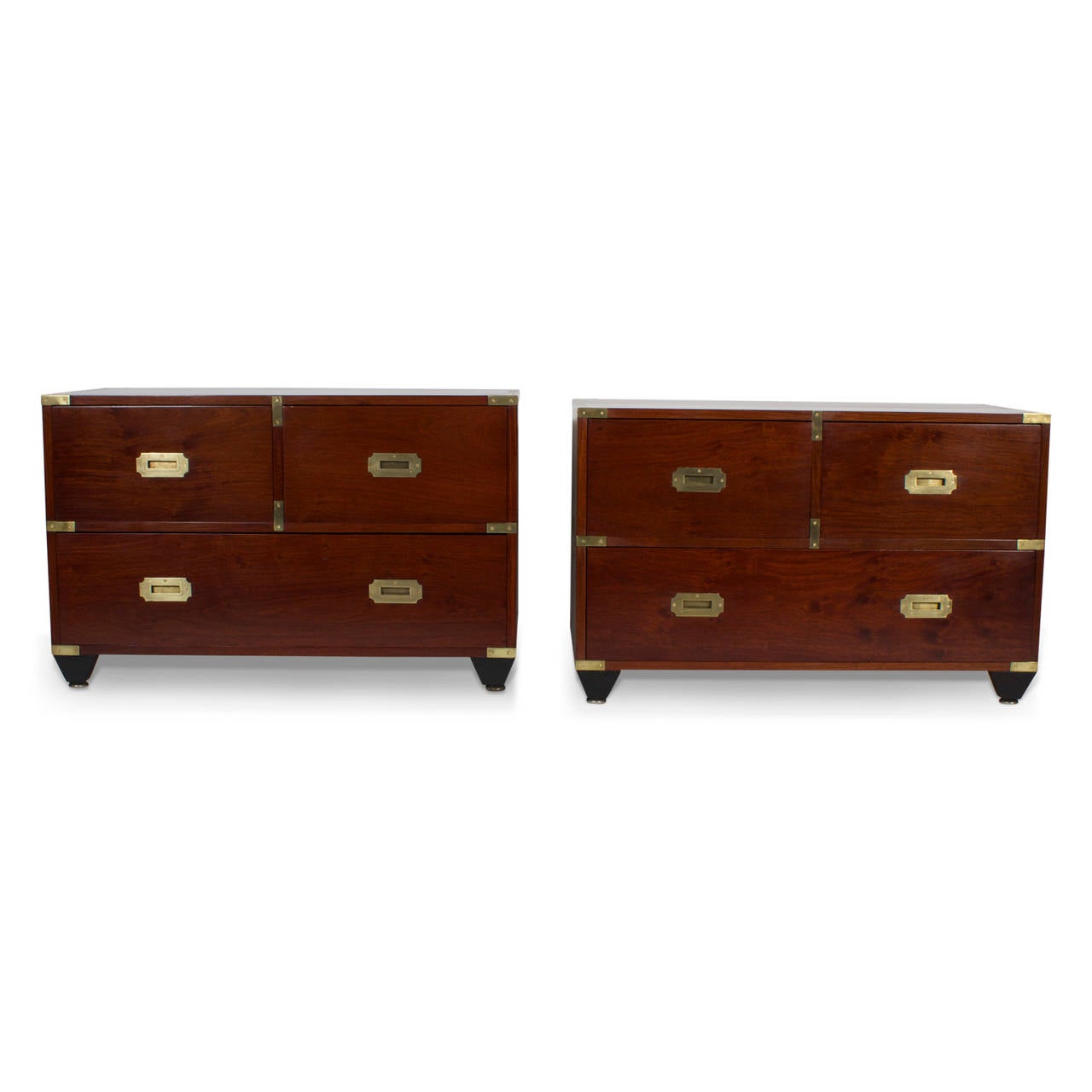 A fine pair of Horstmann campaign style night stands, made in a rich mahogany, with dovetailed cases and classic brass campaign style hardware with ebonized tapered feet. High quality construction with a modern scale. Brass label Charlotte