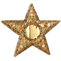 Miroir en forme d'étoile en coquillage et porcelaine incrustée