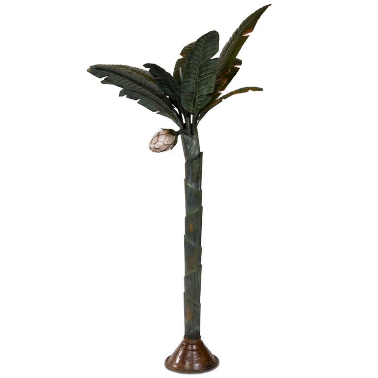 A painted metal palm tree or banana with removable leaves. Detailed trunk and leaves and a fabulous white flower. What is it about palm trees, that conjures up the romantic? Perfect for any place in the house that needs some zap.
 