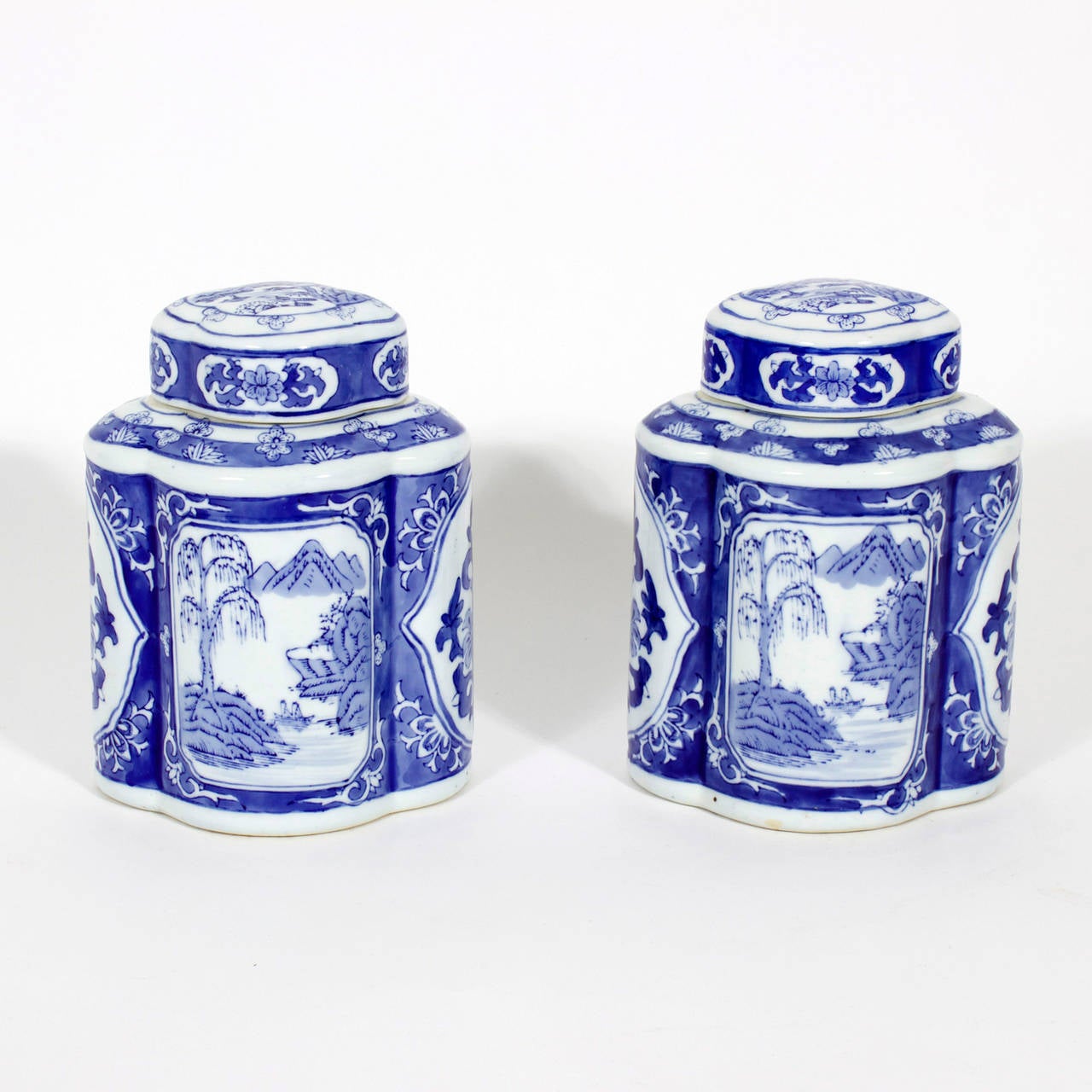 A pair of Chinese export blue and white lidded canisters with a landscape motif. Nice form and sweet size. Blue and white so versatile, for so many decors.