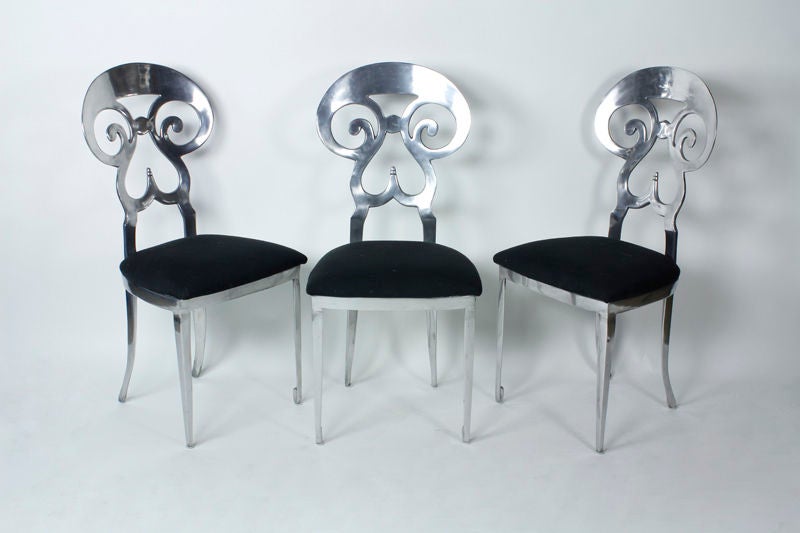 A set of 6 custom Biedermeier style dining chairs. A traditional form in a more modern material. Super decorative.