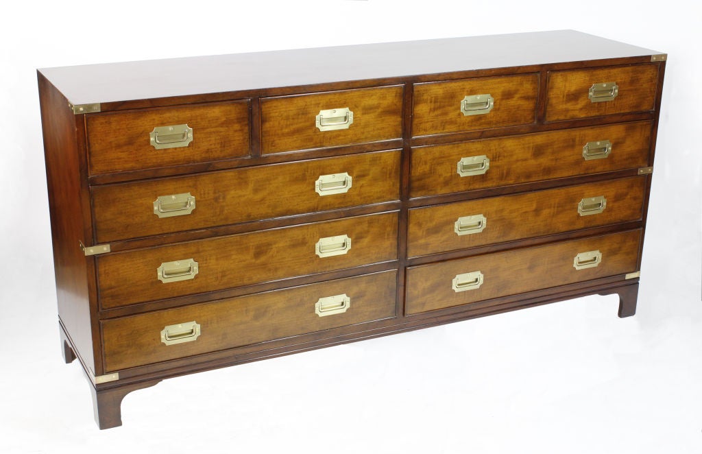 A campaign style double dresser or sideboard by Beacon Hill, with beautiful mahogany and an outside bracket base. <br />
<br />
Please visit our extensive website for other campaign furniture:<br />
www.fshenemaderantiques.com