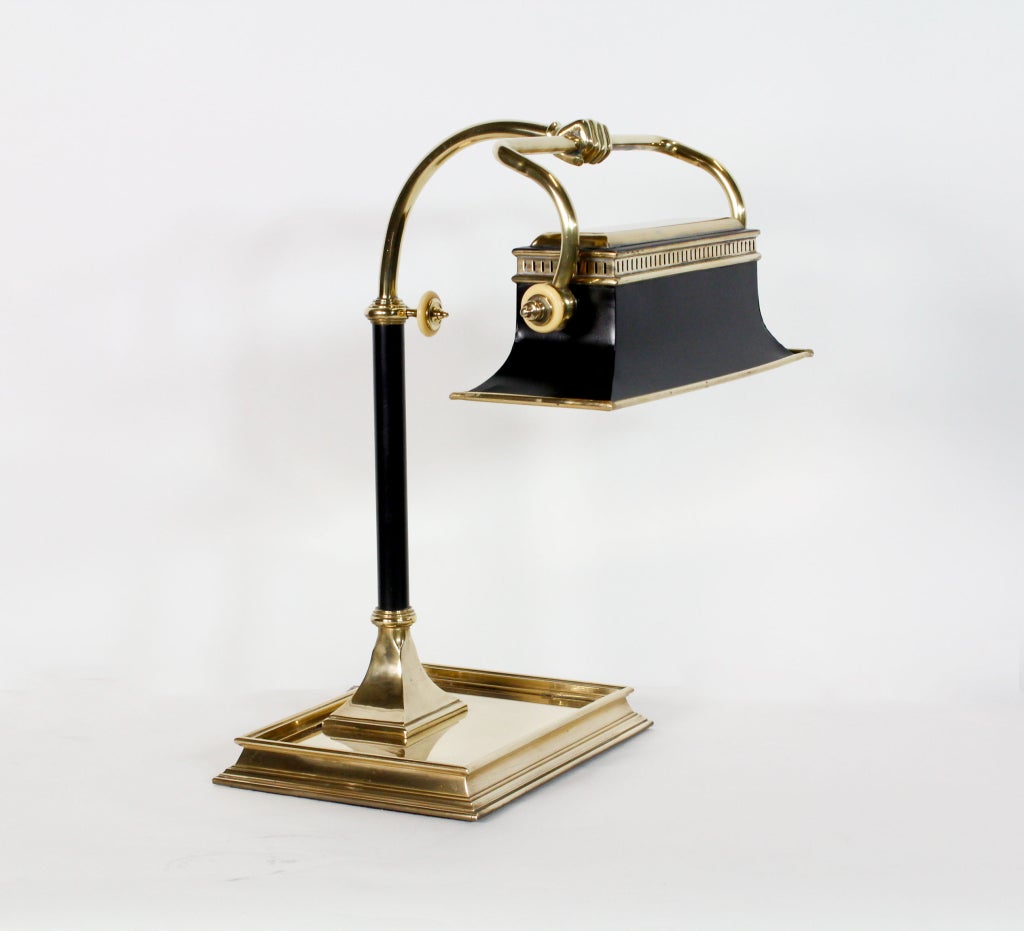 A very cool large desk lamp, with a patinated brass rectagular shade, held in a brass fist, with a large brass molded base, with fine details.<br />
<br />
Please visit our extensive website for more lamps:<br />
fshenemaderantiques.com