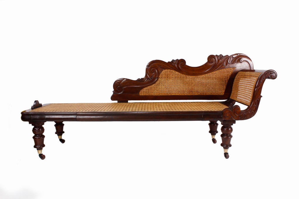 Ah, the romance of the West Indies, tropical breezes, lapping ocean, starry nights, and lounging in your carved mahogany, turned leg, caned or cane chaise longue.  West Indian antique furniture defines the British Colonial decor. This wonderful