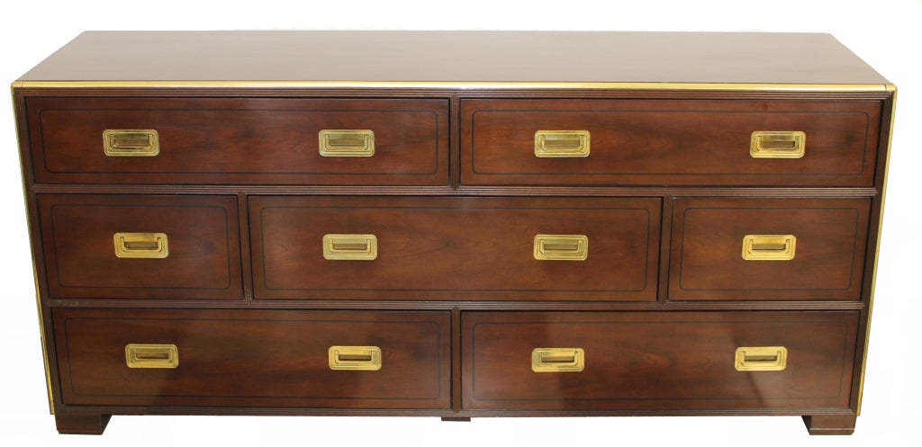 A mahogany campaign style double chest, double dresser, or long chest, however you describe it, this piece has pizzazz. Line inlay accents the drawers, etched brass trims the case and the blocked feet are a perfect ending to a delightful piece of