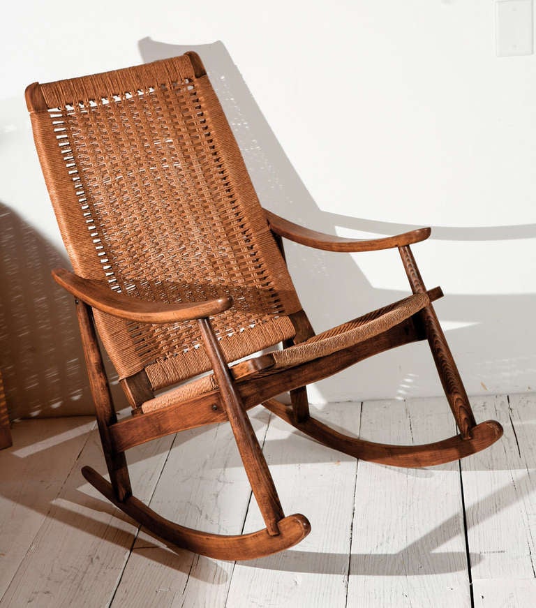 Quaint rocking chair with matching ottoman. Beautiful rush detailing.