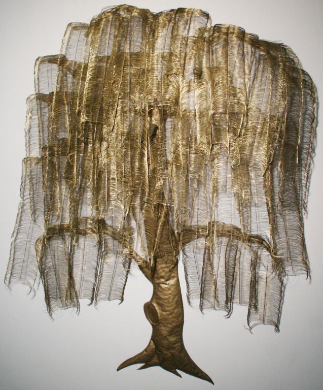 Whimsical and stunning huge brass tree wall sculpture, c. 1970s USA, possibly designed by C. Jere. 
Layers of overlapping branches and twigs with many feathered brass leaves. Brass trunk with roots. So eye catching and more of a rare piece. A very
