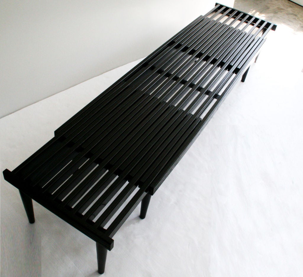 Expandable Wood Slat Bench, c. 1950's USA. Newly refinished in a beautiful ebony with deep brown highlights, and sleek gloss finish. Can be pushed in or extended fully out, as a table or bench. Extends from 4 feet 7 inches long, up to 8 feet long.