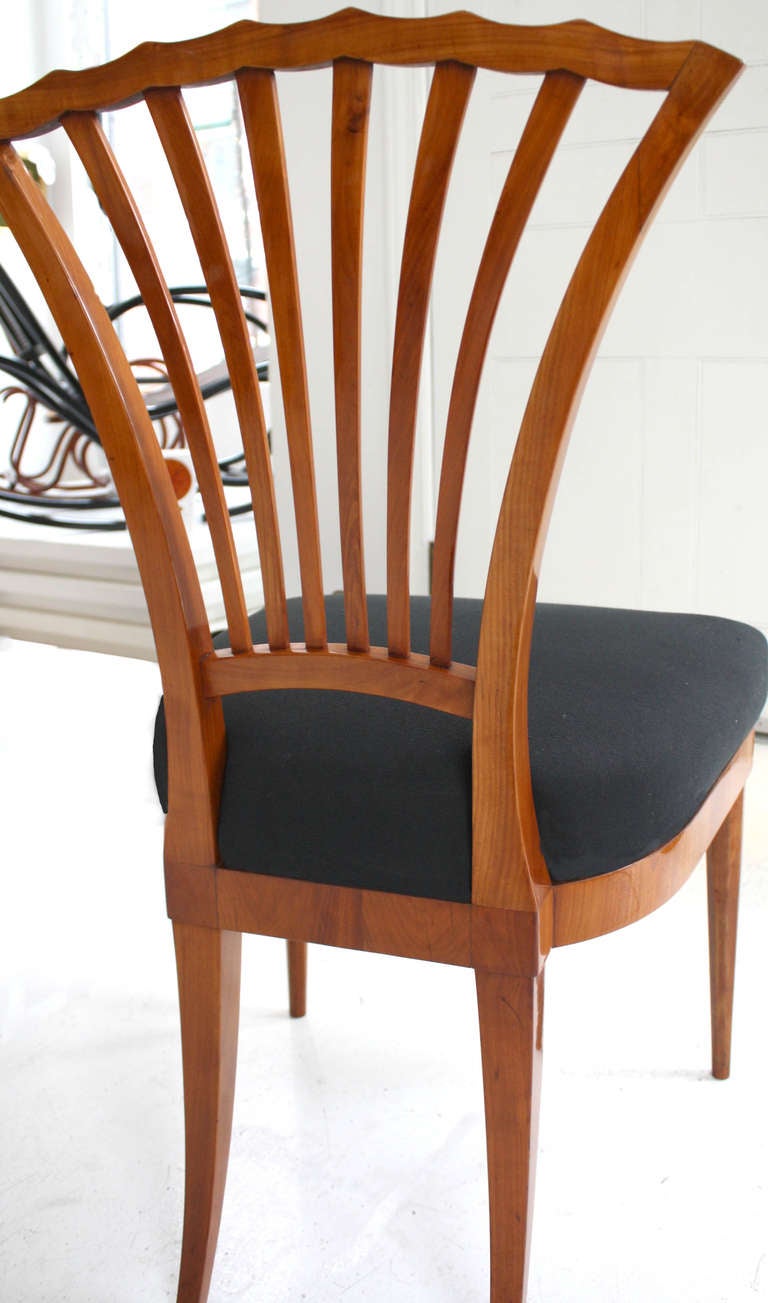 Biedermeier chair with open fan-shaped, fluted back. The clean lines of this chair were crafted from solid native cherry wood.