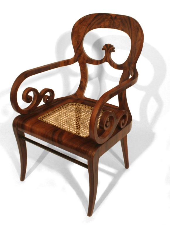This important chair elegantly shows the transition from the Biedermeier style to that of the popular later period of Vienna Secession's Bentwood style.