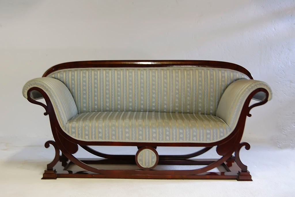 Vienna, c. 1820
Mahogany veneer

This elegant settee exemplifies the enduring craftsmanship and beauty at the height of the Biedermeier period. The straight and curved lines of this stunning piece converge to make a bold statement, the perfect