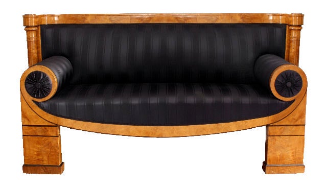 Vienna,  c. 1820
Birch with ebony inlay

The clean lines and strong architectural design exemplify the inventiveness of Josef Danhauser's workshop.  This magnificent sofa is characterized by the inward curving back which is supported by columns. 