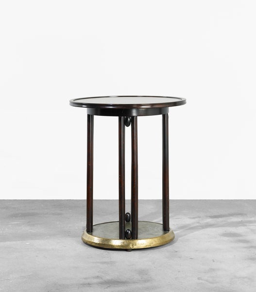 The striking lines of this Fledermaus occasional table reflect the influential style of its designer, the architect Josef Hoffmann. A document of its time, this mahogany-stained and polished beechwood table features a hand-hammered brass base. The
