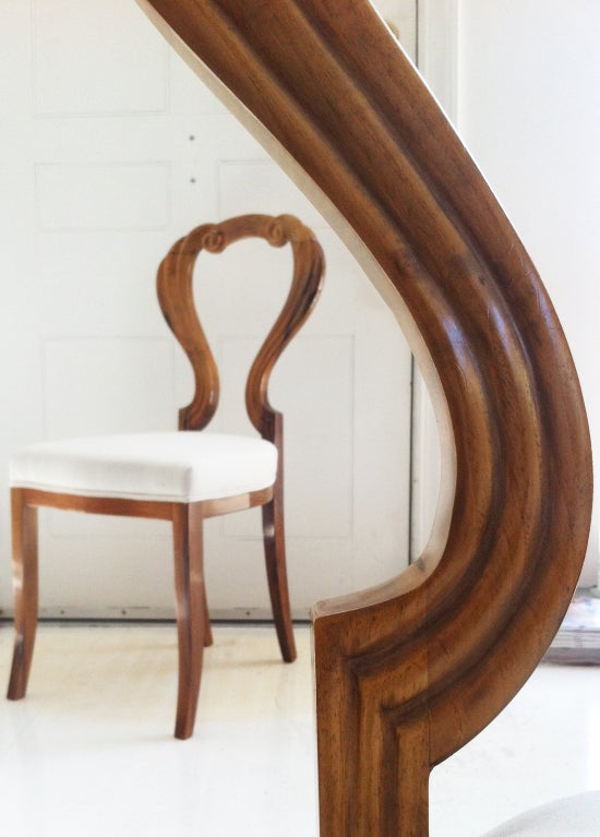 The whimsical form of this chair is accompanied by the beautifully matched veneer, serving as a wonderful example of the lyrical elegance of the Biedermeier period.